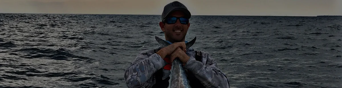 Captain Jason at the wheel of the Cool Runnings 32 ft Contender on a Fort Lauderdale fishing trip